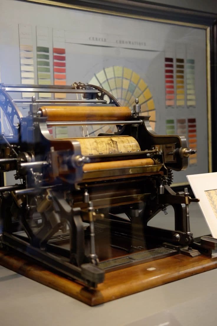 Printing expert inspecting a freshly bound book